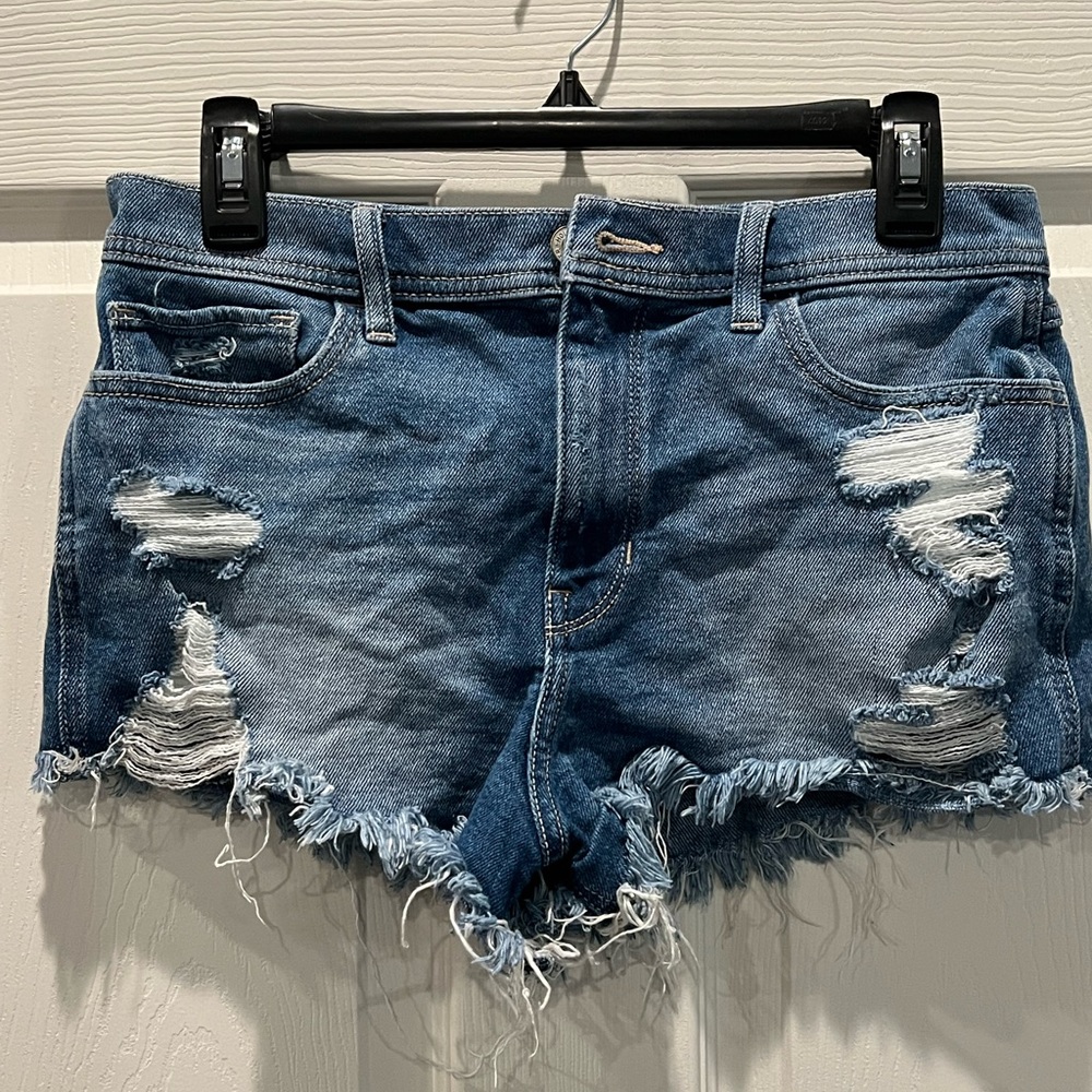 Hollister shorts size 7 distressed a lot in dark blue
